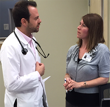 Resident and social worker conferring