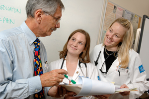 Doctor working with two residents