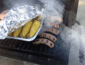 Brats and corn on grill