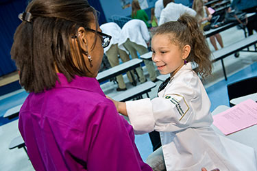 photo of a medical student with a child