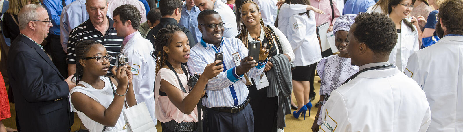 photo of a family taking photos of their medical student