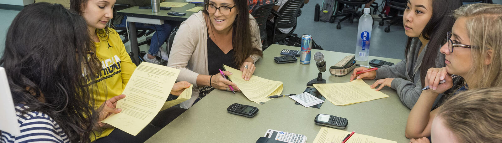 photo of students sitting at a table working together