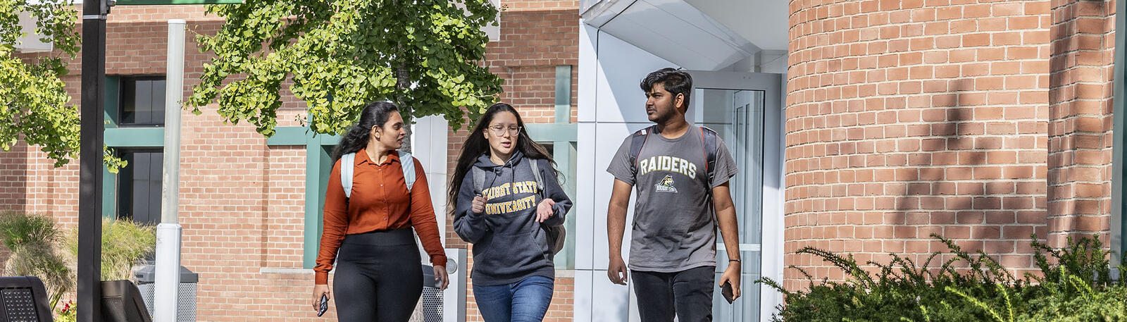 photo of students walking outside on campus