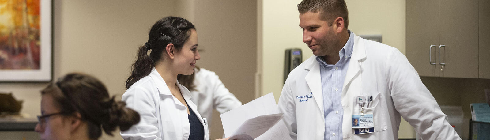 photo of a resident and physician talking 