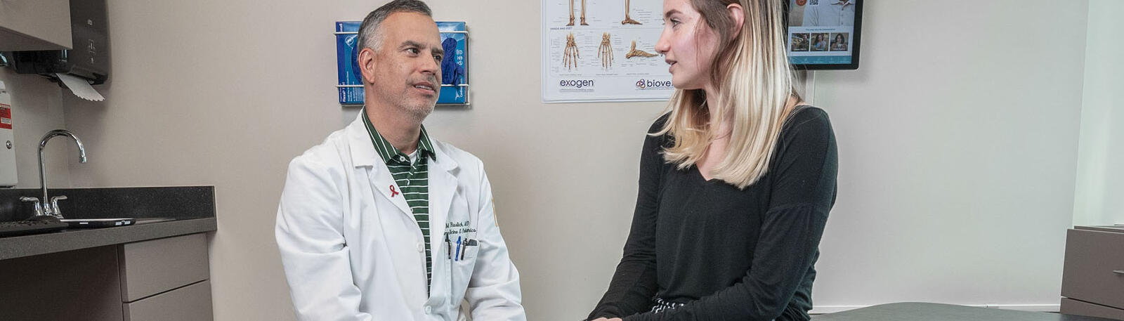 photo of a physician and patient in an exam room