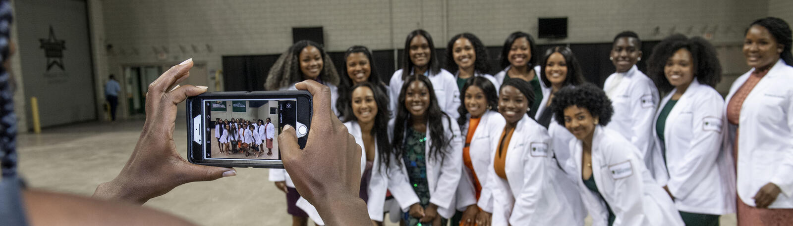 photo of a group of students posing for a photo at an event