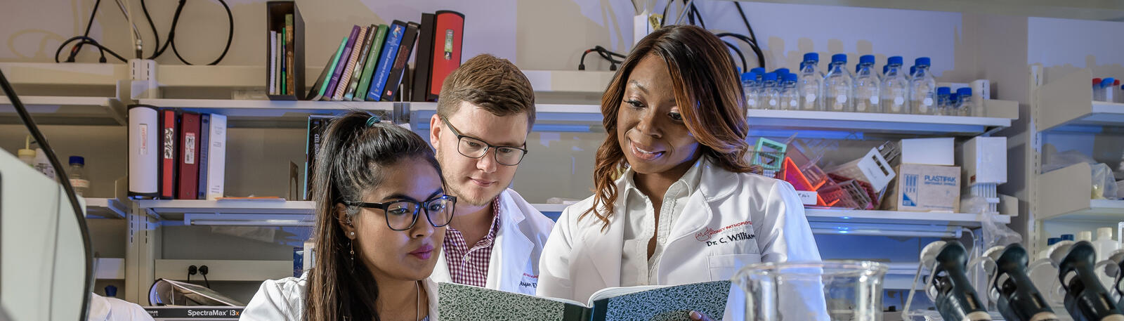 researcher and students working in a lab