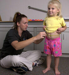 little girl being measured