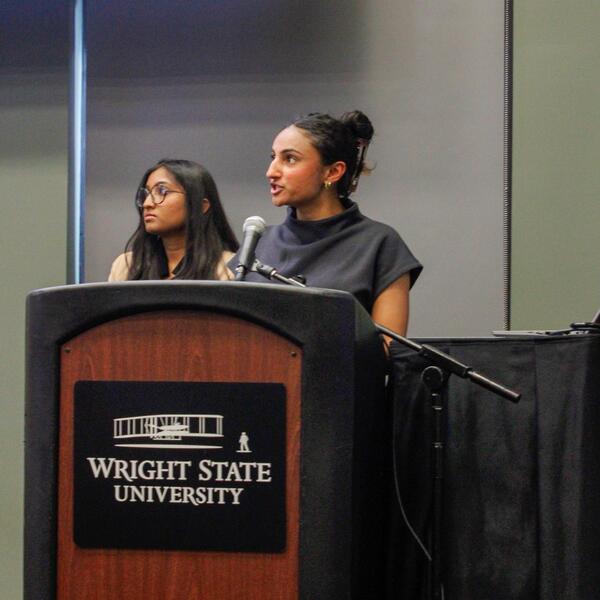 researcher presents at podium