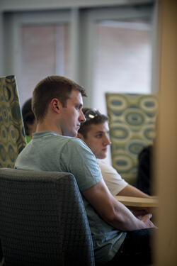 photo of students sitting at a table