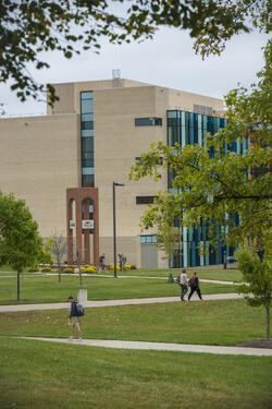 photo of students walking outside the nec building