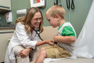 a medical student with a patient