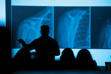 a medical student looking at xrays